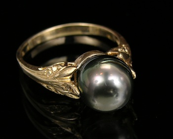 Appraisal: A Black Pearl Ring in Yellow Gold k yellow gold