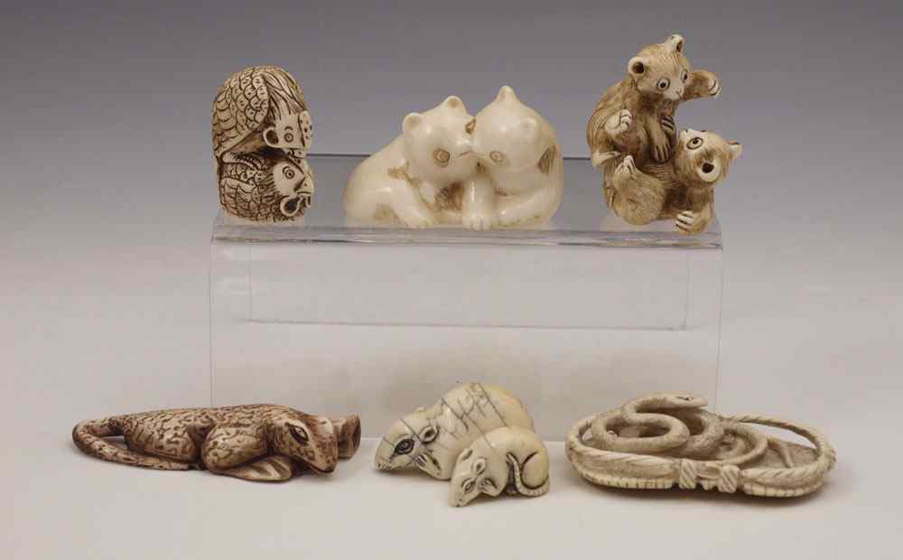 Appraisal: PIECE CARVED IVORY ANIMALS NETSUKE To include Pair of bears