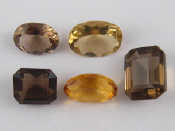 Appraisal: A mixed lot comprising five loose polished citrine smokey quartz