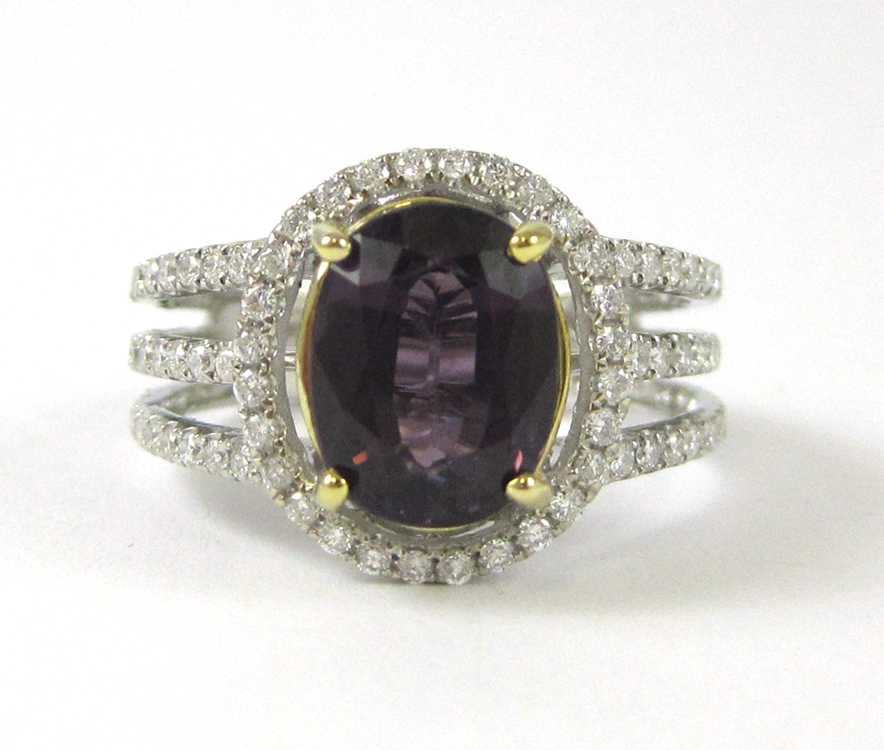 Appraisal: PURPLE SPINEL AND FOURTEEN KARAT GOLD RING The white and