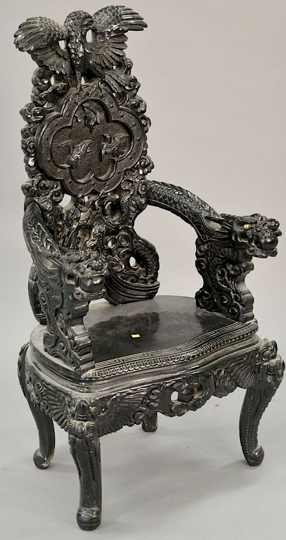 Appraisal: Carved Oriental armchair with dragon carved hand rests ht in