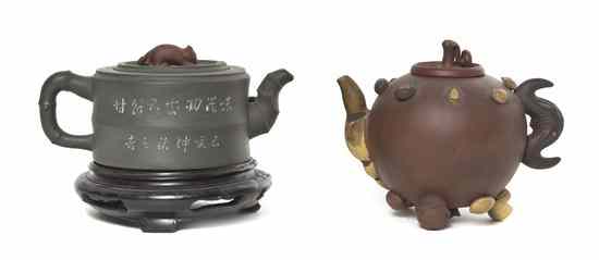 Appraisal: A Group of Two Yixing Pottery Teapots the first having