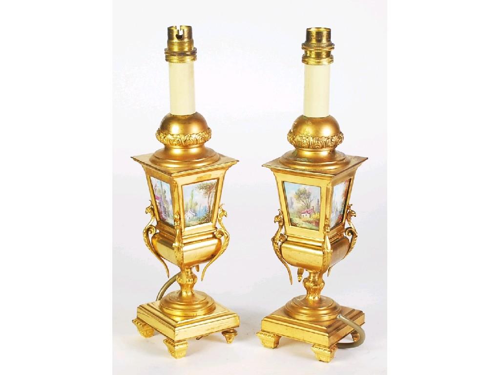 Appraisal: PAIR OF GILT METAL AND PORCELAIN ELECTRIC TABLE LAMPS of