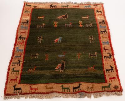 Appraisal: A Persian Gabbeh rug central dark green field within a