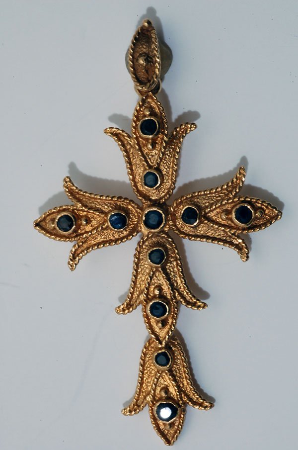 Appraisal: Cast K yellow gold cross stamped accented with eleven round