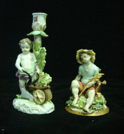 Appraisal: A German porcelain figural candlestick of a child gardener cm