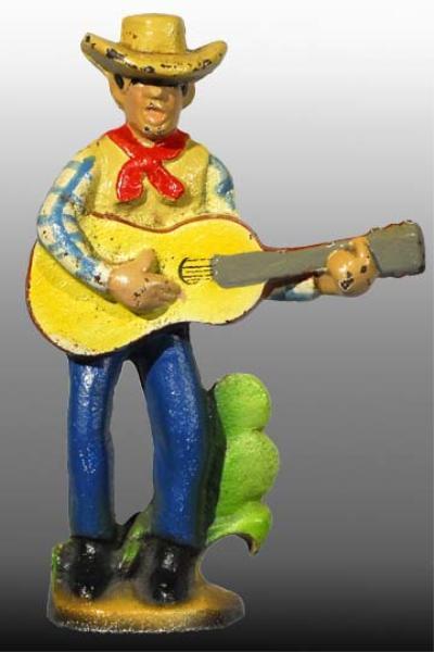 Appraisal: Cast Iron Cowboy with Guitar Bottle Opener Description Made by