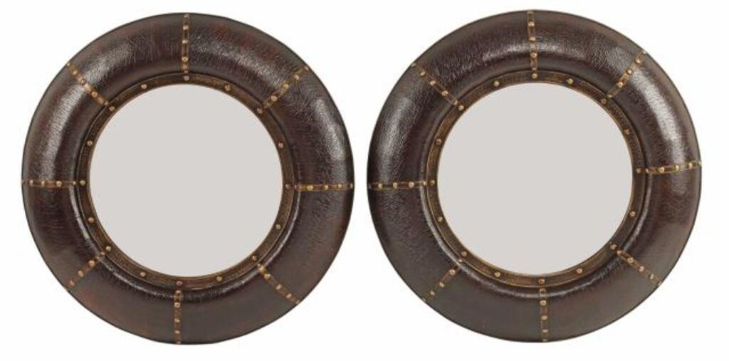 Appraisal: pair Portuguese style leather framed circular mirrors frame encasing beveled