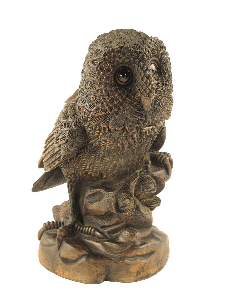 Appraisal: A carved and stained wood owl tobacco jar