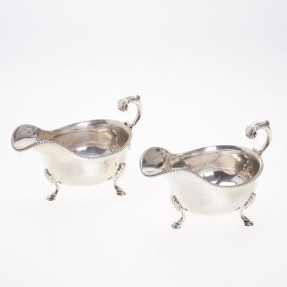 Appraisal: Pair Edwardian sterling silver footed sauceboats Pair Edwardian sterling silver