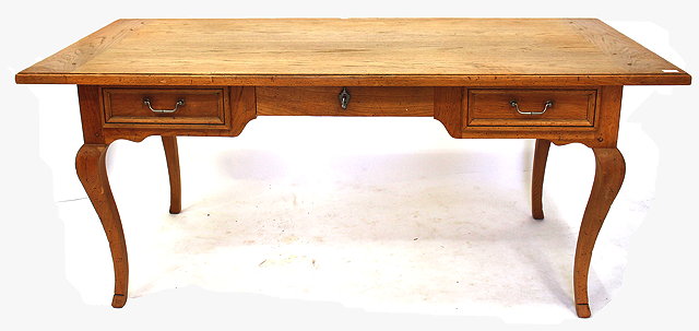 Appraisal: A FRENCH BLEACHED OAK RECTANGULAR BUREAU PLAT fitted three drawers