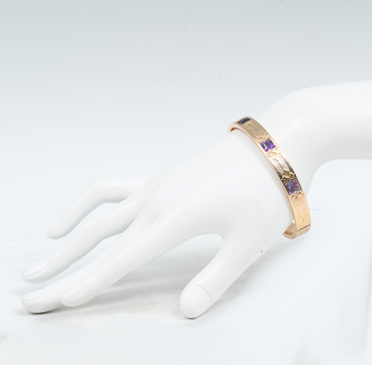 Appraisal: K DESIGNED BANGLE WITH INSET AMETHYST Ca - K yellow