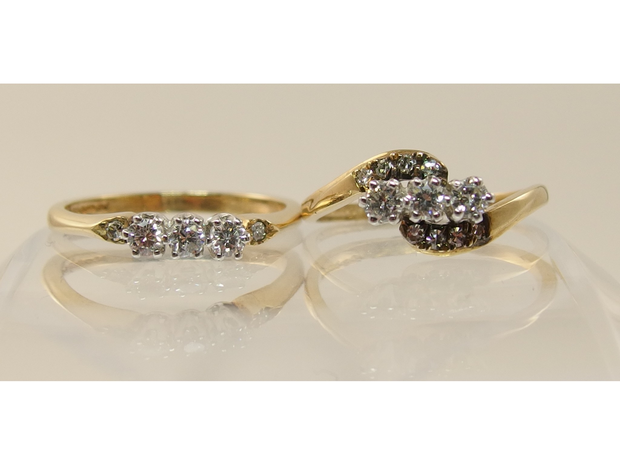 Appraisal: A three stone diamond ring on a twist of approximately