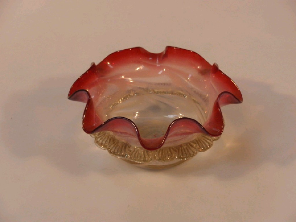 Appraisal: A Victorian cranberry opalescent and lemon glass bowl with wavy