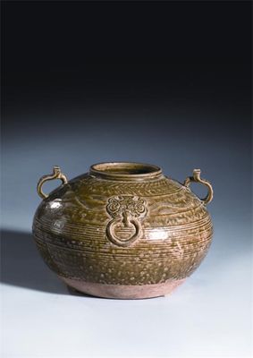 Appraisal: A Chinese green glazed stoneware two-handled jar the compressed circular