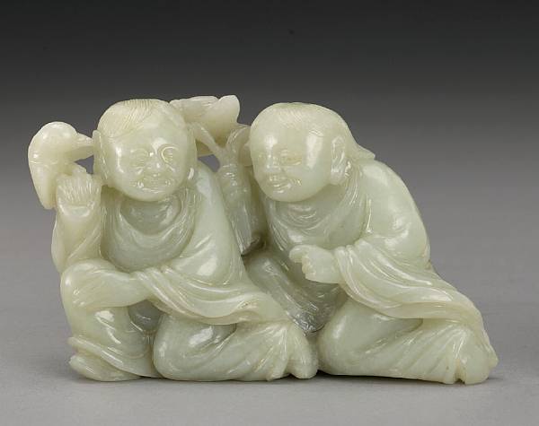 Appraisal: A small carved nephrite figure group Depicting the He He