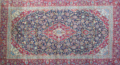 Appraisal: PERSIAN HERIZ Area rug with ivory and red floral medallion