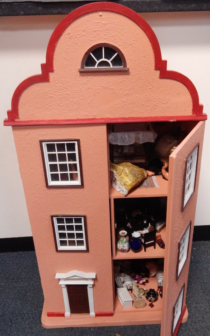 Appraisal: A Dutch style doll's house containing furniture ornaments dolls etc