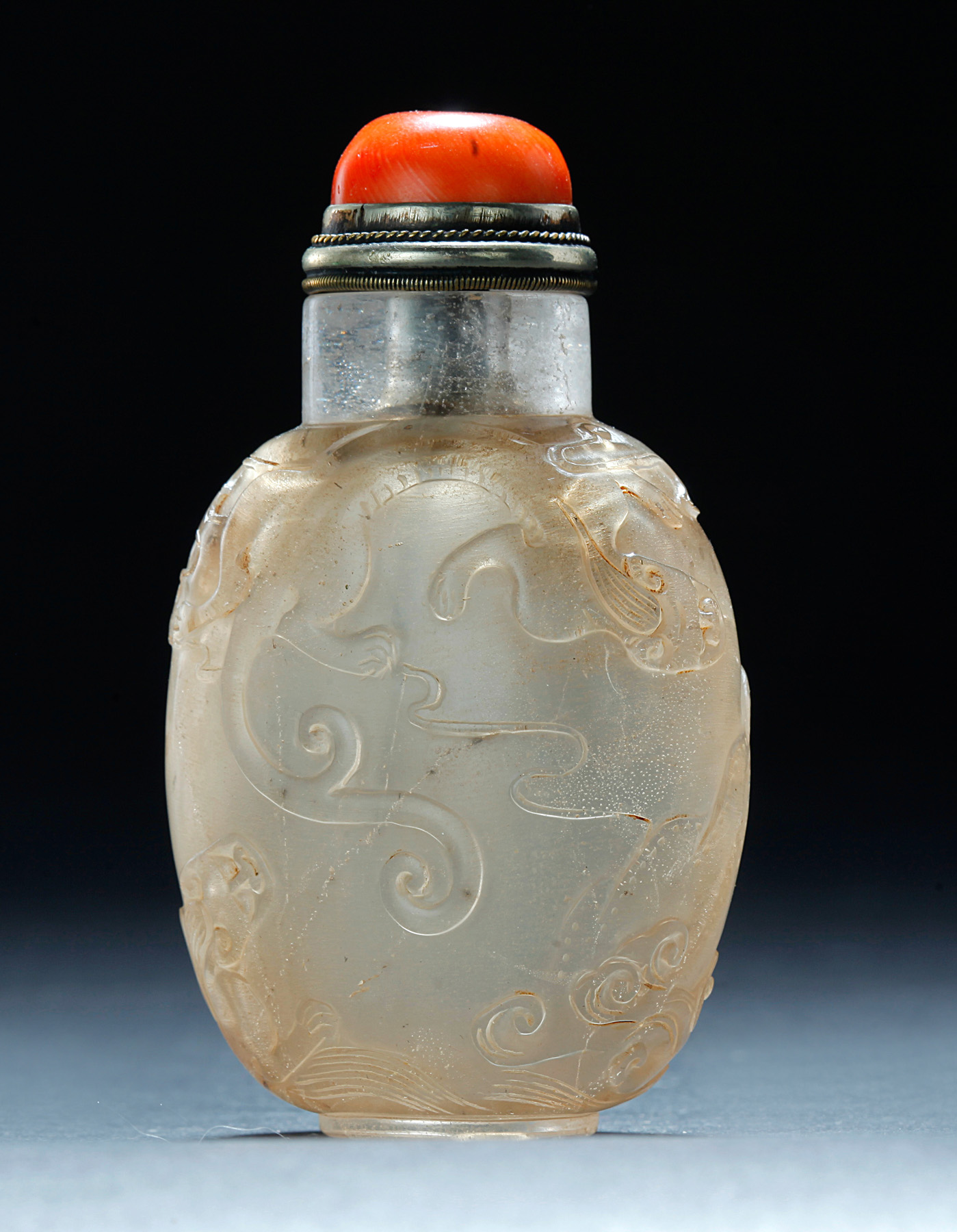 Appraisal: CHINESE CRYSTAL SNUFF BOTTLE Late th century Three dragons chasing