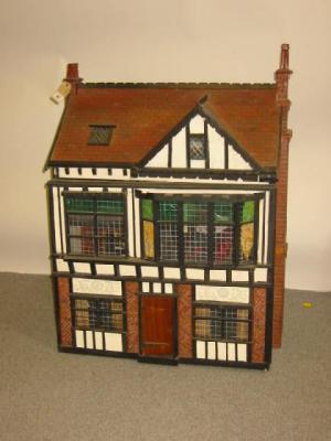 Appraisal: A painted wood doll's house scratch built with pitched and