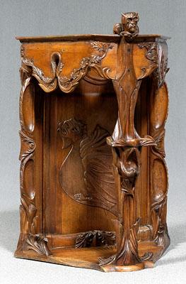 Appraisal: Art Nouveau carved corner cabinet fruitwood throughout carved devil finial