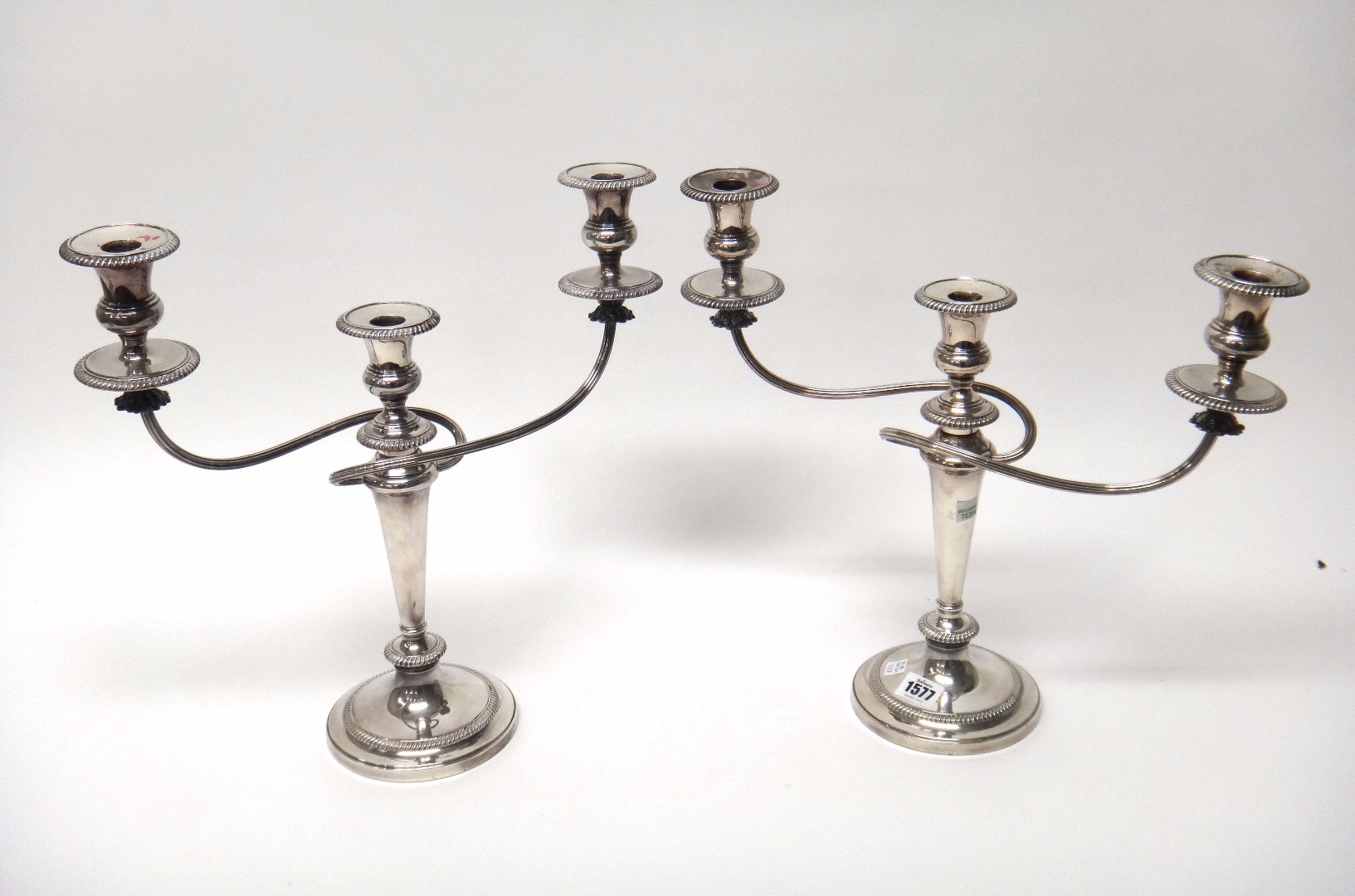 Appraisal: A pair of plated three light table candelabra each having