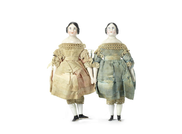 Appraisal: Pair of glazed china shoulder head dolls circa With finely