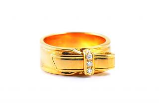 Appraisal: A Gold Diamond Band by Hermes Set with circular-cut diamonds