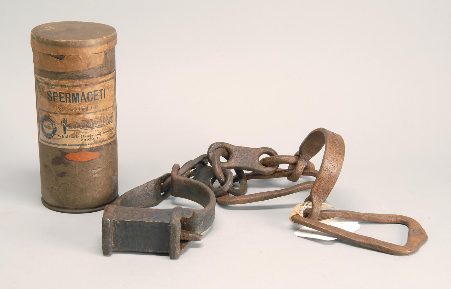 Appraisal: TWO ITEMS A cardboard canister with spermaceti label from the