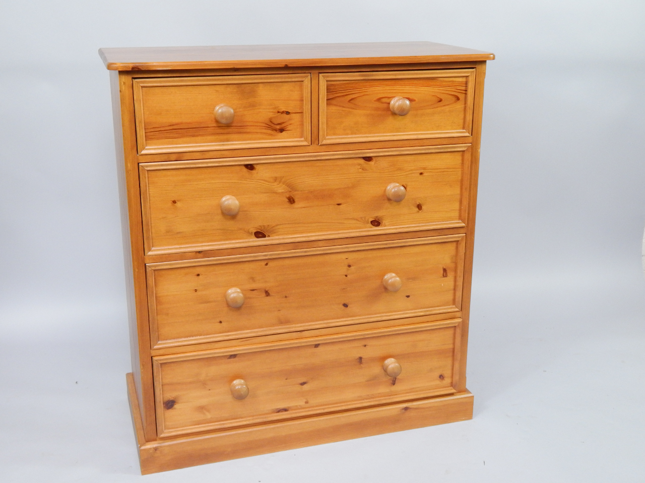 Appraisal: A pine chest of drawers two short and three long