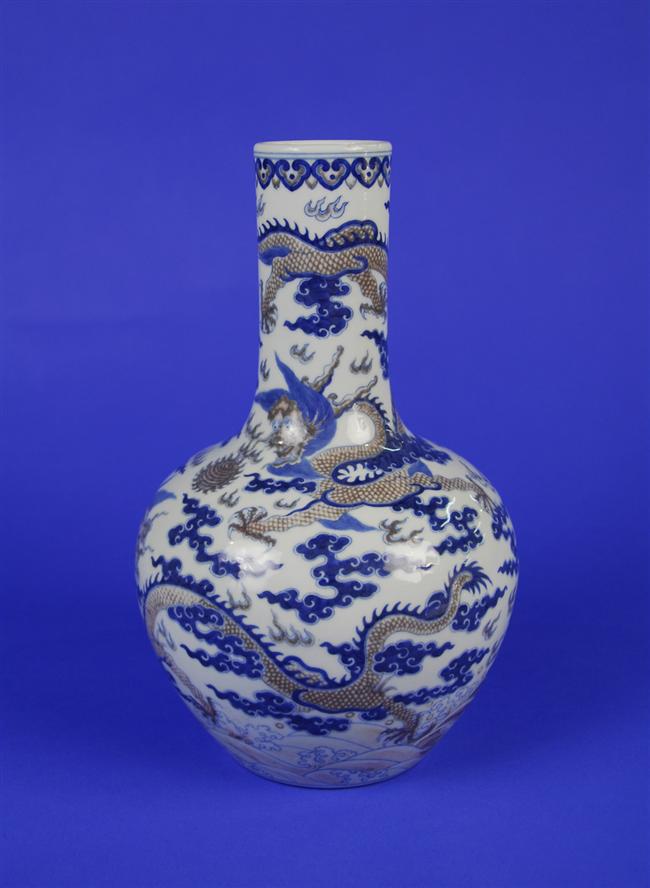 Appraisal: CHINESE BLUE WHITE AND IRON RED BOTTLE FORM VASE Qing