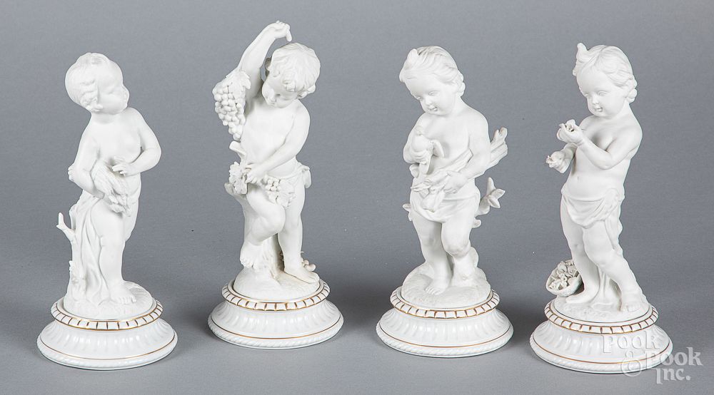 Appraisal: Set of four bisque and porcelain putti figures Set of