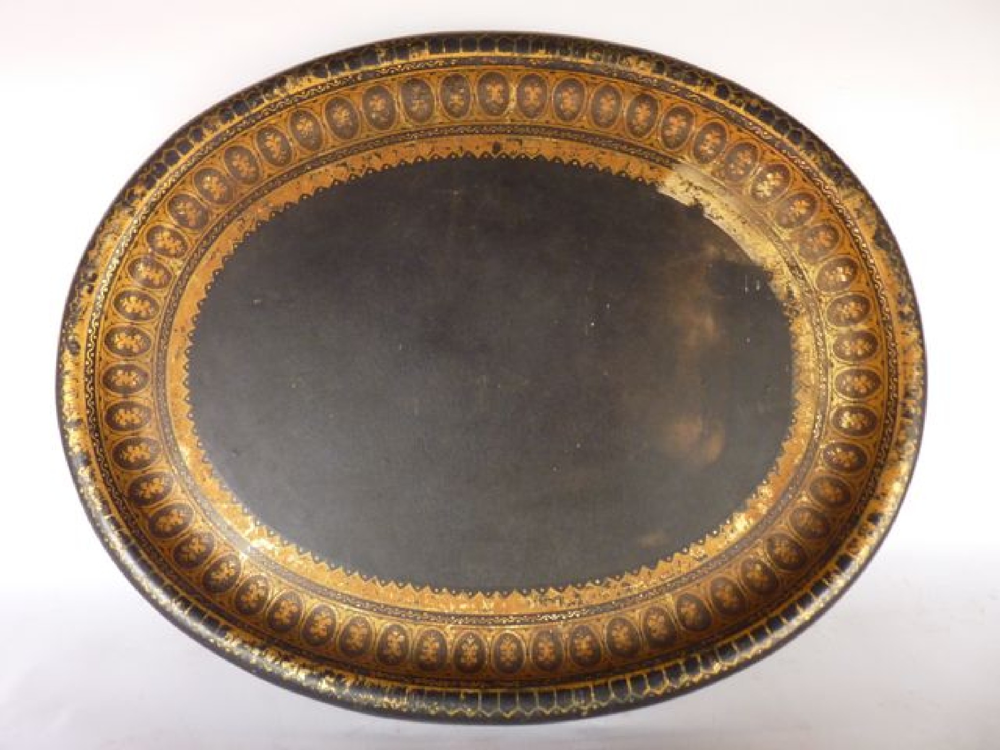 Appraisal: A lacquer work tray of oval form the ebonised ground