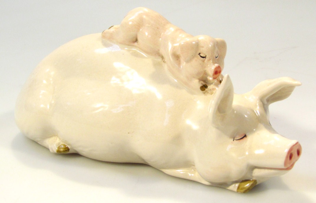 Appraisal: A thC Beswick pottery figure group of sleeping pig and