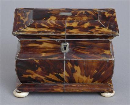 Appraisal: REGENCY TORTOISESHELL VENEERED BOMBE TEA CADDY The flattened dome lid