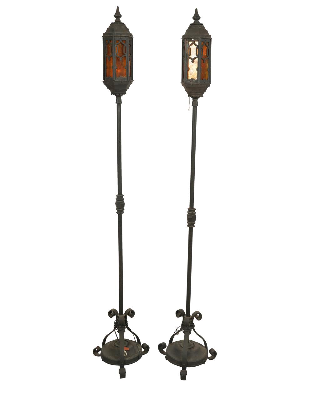 Appraisal: PAIR OF CONTINENTAL WROUGHT IRON MICA TORCHERESelectrified Condition one mica