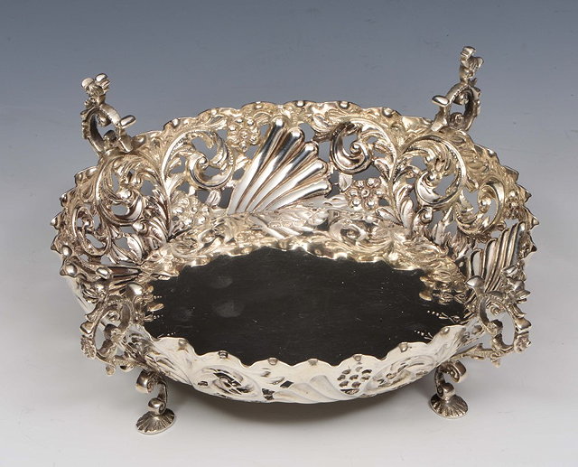 Appraisal: A VICTORIAN SILVER BOWL with pierced sides decorated with scrolls