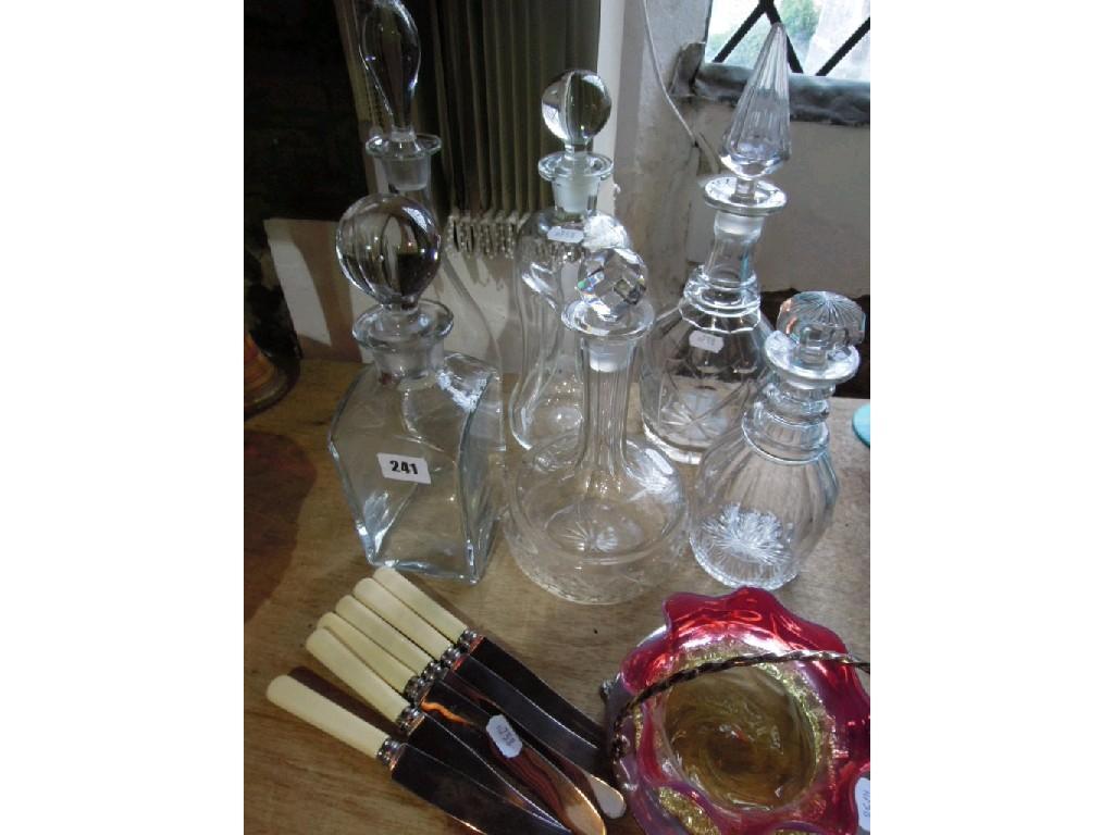 Appraisal: A collection of various decanters and stoppers including ring necked