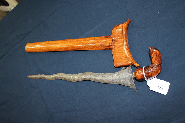 Appraisal: AN ANTIQUE KRIS with carved hardwood handle with a hardwood