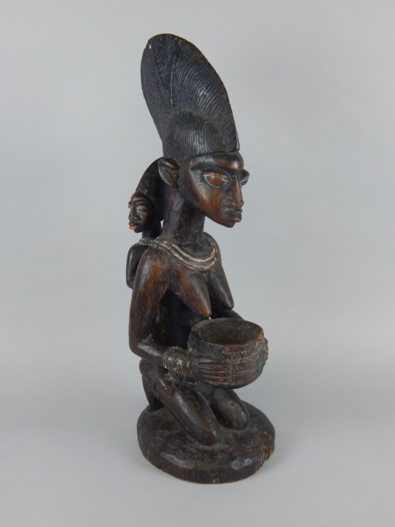 Appraisal: Tribal Art An African carved wooden figure in the form