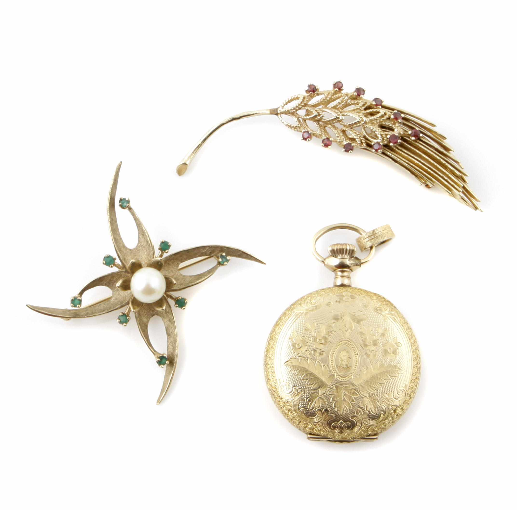 Appraisal: Two gem-set and gold brooches together with a metal pocketwatch