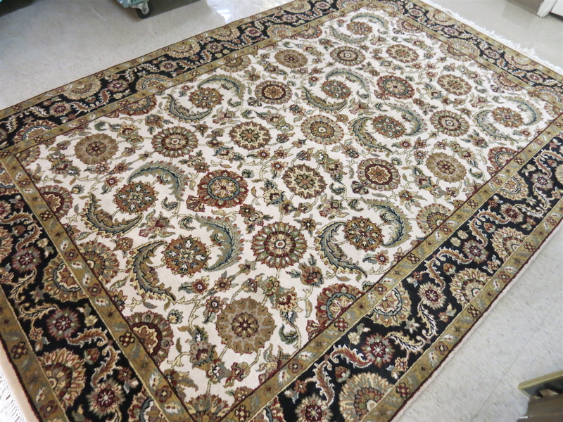 Appraisal: HAND KNOTTED ORIENTAL CARPET Indo-Persian overall floral design on cream