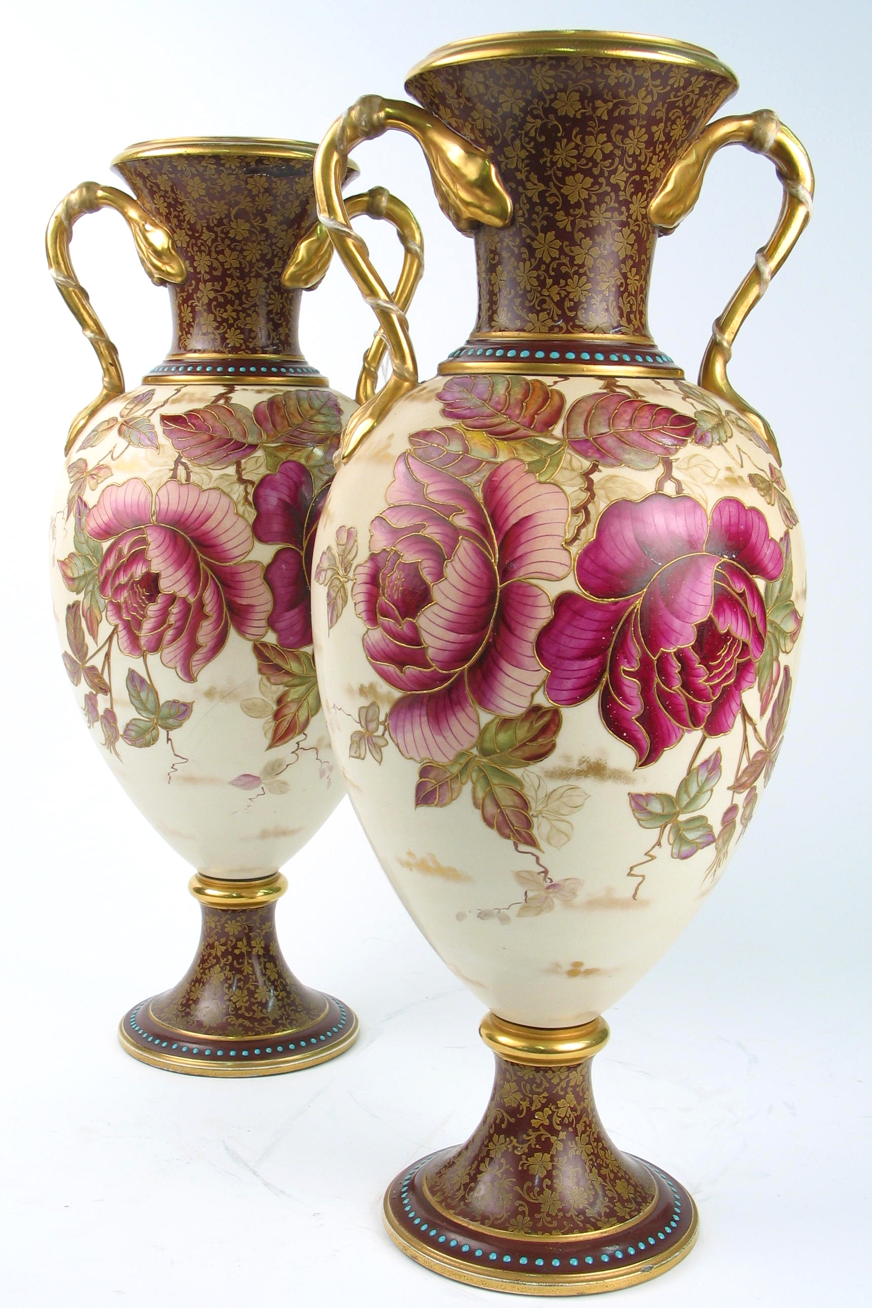 Appraisal: PAIR OF FRENCH PORCELAIN VASES having hand painted plum and