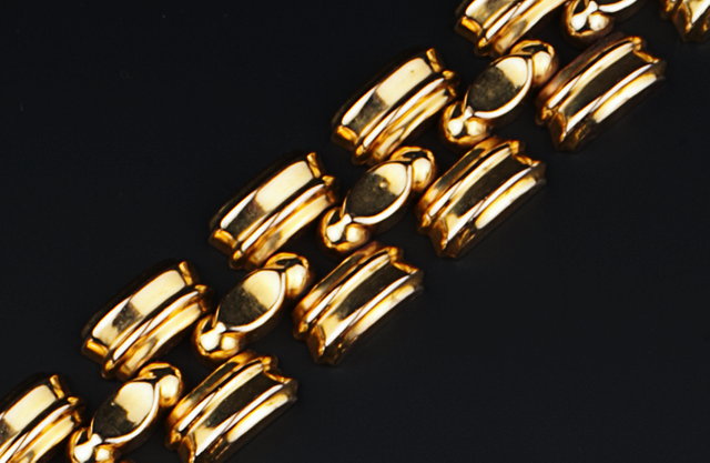 Appraisal: A FANCY PANEL-LINK BRACELET of odeonesque design stamped ' k'