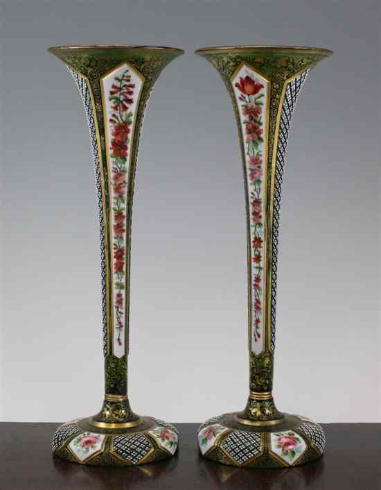 Appraisal: A pair of Bohemian enamelled and overlaid glass trumpet vases