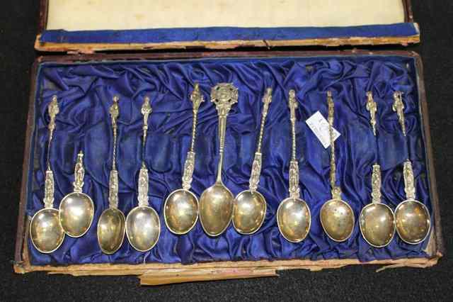 Appraisal: A CASED SET OF SILVER MOSTLY APOSTLE SPOONS with turned