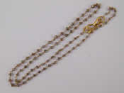 Appraisal: A gold and diamond necklace diamonds approx mm diameter necklace