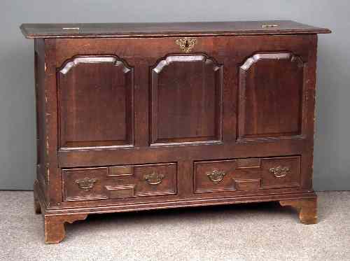 Appraisal: A mid th Century panelled oak mule chest with plain