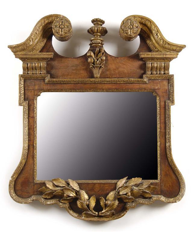 Appraisal: A George II style walnut and parcel gilt wall mirror