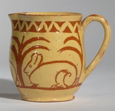 Appraisal: A Farnham Pottery jug by W Hewitt resist decorated in